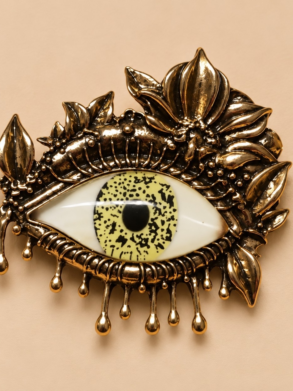 Gold Floral Eye Brooch with Yellow Accent